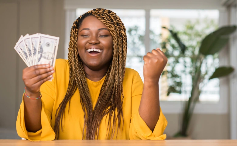 woman happy holding money